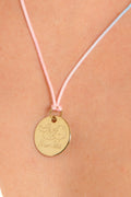 MÉDAILLE SYMBOLE DORÉ BEBE